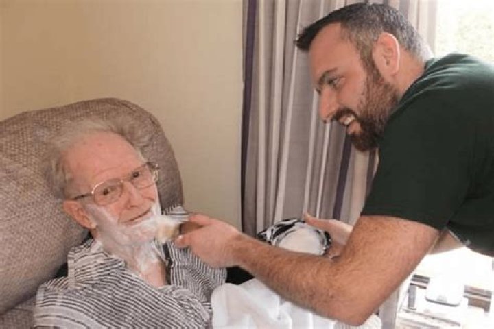 Dementia-friendly barber brings cheer to care home customers